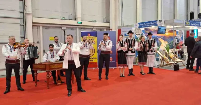 Cinematic close-up of traditional Romanian folk dancers in authentic handmade costumes performing a high-energy traditional dance.